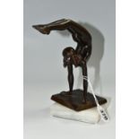 AN ART DECO STYLE BRONZE FIGURE OF A NUDE FEMALE ACROBAT AFTER CARL JOHAN BONNESEN, marked to the