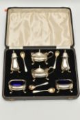 A MID 20TH CENTURY SILVER CASED 'SYNYER & BEDDOES' CREUT SET, comprising of two salts with blue