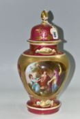 A VIENNA STYLE COVERED VASE, printed and tinted with three figures in a landscape on a cerise gilt