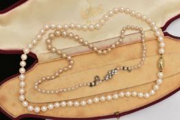 A CULTURED PEARL NECKLACE AND AN IMITATION PEARL NECKLACE, the first a single row of individually
