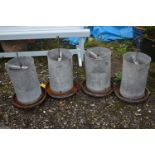 FOUR ELTEX GALVANISED CHICKEN FEEDERS, height approximately 70cm (condition report: rusty finish,