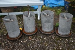 FOUR ELTEX GALVANISED CHICKEN FEEDERS, height approximately 70cm (condition report: rusty finish,