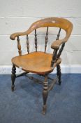 A 19TH CENTURY ELM DESK ARMCHAIR, with turned spindles, and stretchers (condition report: aged