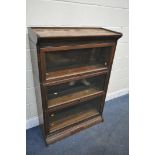 AN EARLY 20TH CENTURY OAK THREE TIER SECTIONAL BOOKCASE, with glazed hide and fall doors, width 87cm