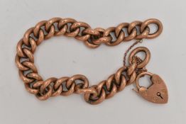 A YELLOW METAL CURB LINK BRACELET, fitted with a heart padlock clasp, clasp stamped 9ct, each link