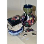 TWO PIECES OF MOORCROFT POTTERY AND A MACINTYRE SUGAR BOWL, all in very poor condition, the