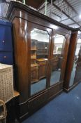 AN EDWARDIAN MAHOGANY DOUBLE DOOR WARDROBE, with mirrored doors, above two drawers, width 162cm x