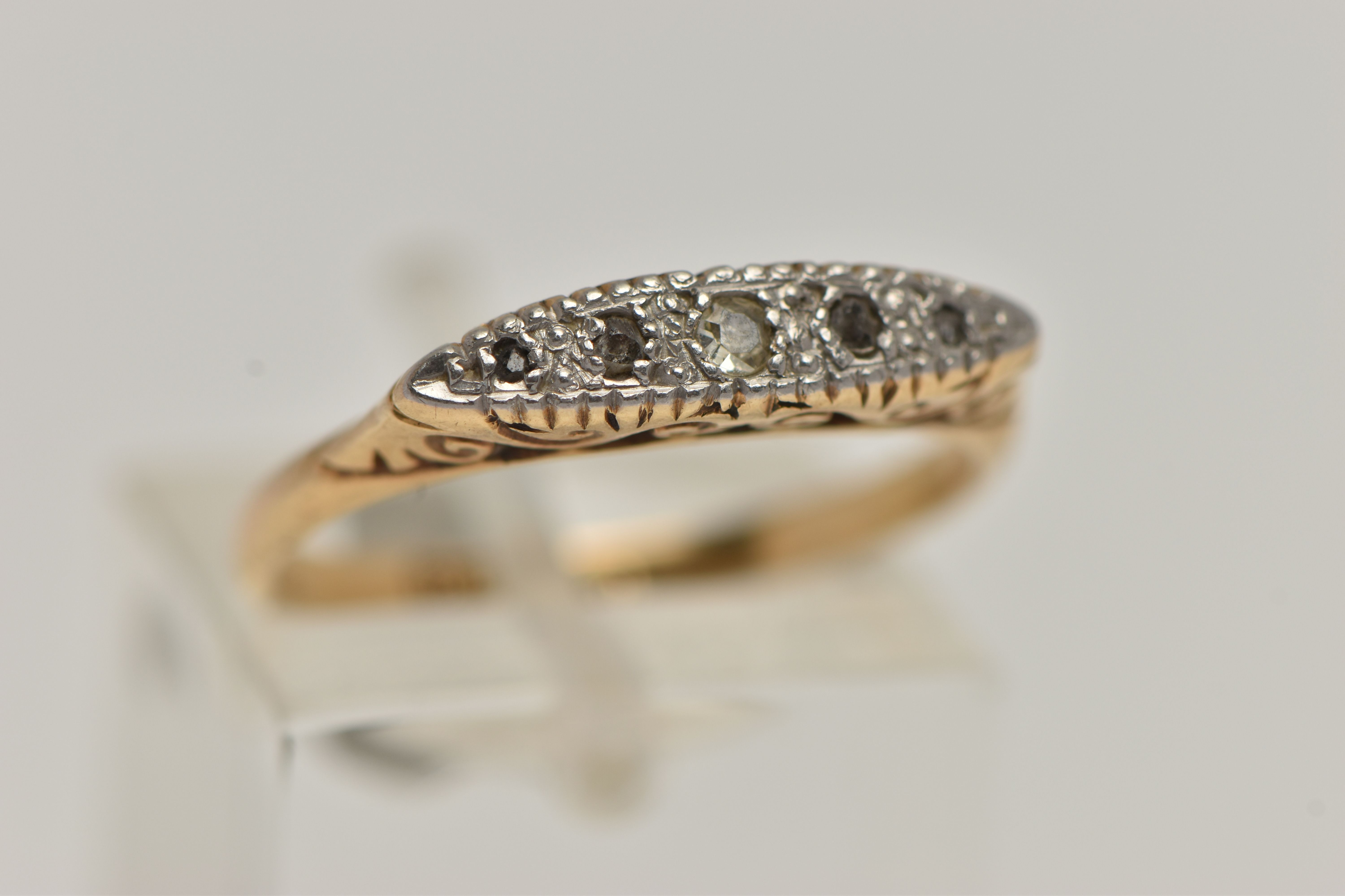A YELLOW METAL DIAMOND RING, set with five diamonds, one single cut and four rose cut diamonds, in a - Image 4 of 4
