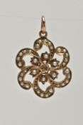 A EARLY 20TH CENTURY 9CT GOLD PENDANT, a yellow gold floral open work pendant, set with seed pearls,
