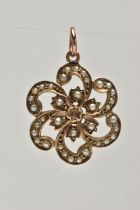 A EARLY 20TH CENTURY 9CT GOLD PENDANT, a yellow gold floral open work pendant, set with seed pearls,