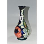 A 1996 MOORCROFT POTTERY BALUSTER VASE, 'Poppy' pattern on a dark blue ground, designed by Rachel