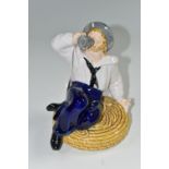 A MAJOLICA FIGURE OF A SEATED SAILOR DRINKING FROM A TANKARD, IN THE STYLE OF MINTON, unmarked,