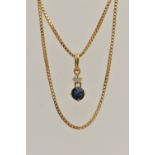 AN 18CT GOLD TWO STONE PENDANT, a round brilliant cut diamond and a circular cut sapphire prong