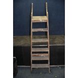 A VINTAGE WOODEN STEP LADDER with a cast iron hinge height 175cm