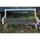 A DISTRESSED GARDEN BENCH, with wooden slats and cast iron ends, length 160cm (condition report: