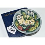 A BOXED MOORCROFT POTTERY 'FRUIT GARDEN' PATTERN TRINKET DISH, impressed and painted marks, gold pen