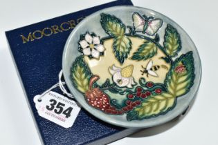 A BOXED MOORCROFT POTTERY 'FRUIT GARDEN' PATTERN TRINKET DISH, impressed and painted marks, gold pen