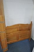 A PINE 4FT6 BEDSTEAD, with side rails and slats (condition report: surface marks)