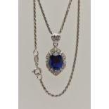 A WHITE METAL PENDANT NECKLACE, the pendant set with an oval cut synthetic blue sapphire in a