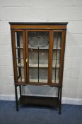 AN EDWARDIAN MAHOGANY ASTRAGAL GLAZED SINGLE DOOR DISPLAY CABINET, on square tapered legs, united by