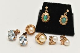 FOUR PAIRS OF GEM SET EARRINGS, the first a pair of yellow gold oval cut blue topaz stud earrings,