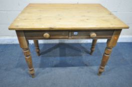 A VICTORIAN STYLE PINE TABLE, with a drop leaf, and two drawers, on turned legs, width 107cm x depth