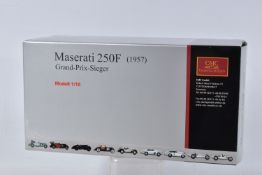 A BOXED CMC 1957 MASERATI 250F GRAND PRIX SIEGER 1:18 MODEL VEHICLE, numbered M-051, serial number