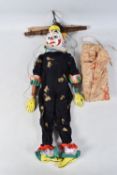 A LARGE CLOWN PUPPET, carved and painted wooden head, wooden body, has some minor wear and appears