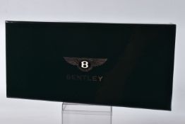 A BOXED MINICHAMPS BENTLEY CONTINENTAL FLYING SPUR SCALE 1:18, painted black with a cream interior