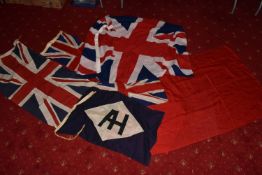 FOUR VINTAGE ROYAL NAVY FLAGS AND ONE OTHER, the flags include two union flags and two red
