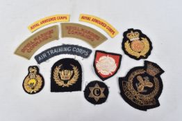 A SELECTION OF CLOTH BADGES AND SHOULDER TITLES FROM BRITISH ARMED FORCES, the shoulder titles
