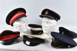 AN ASSORTMENT OF PEAKED CAPS WITH MILITARY INTEREST, theses include Welsh guards, Coldstream guards,