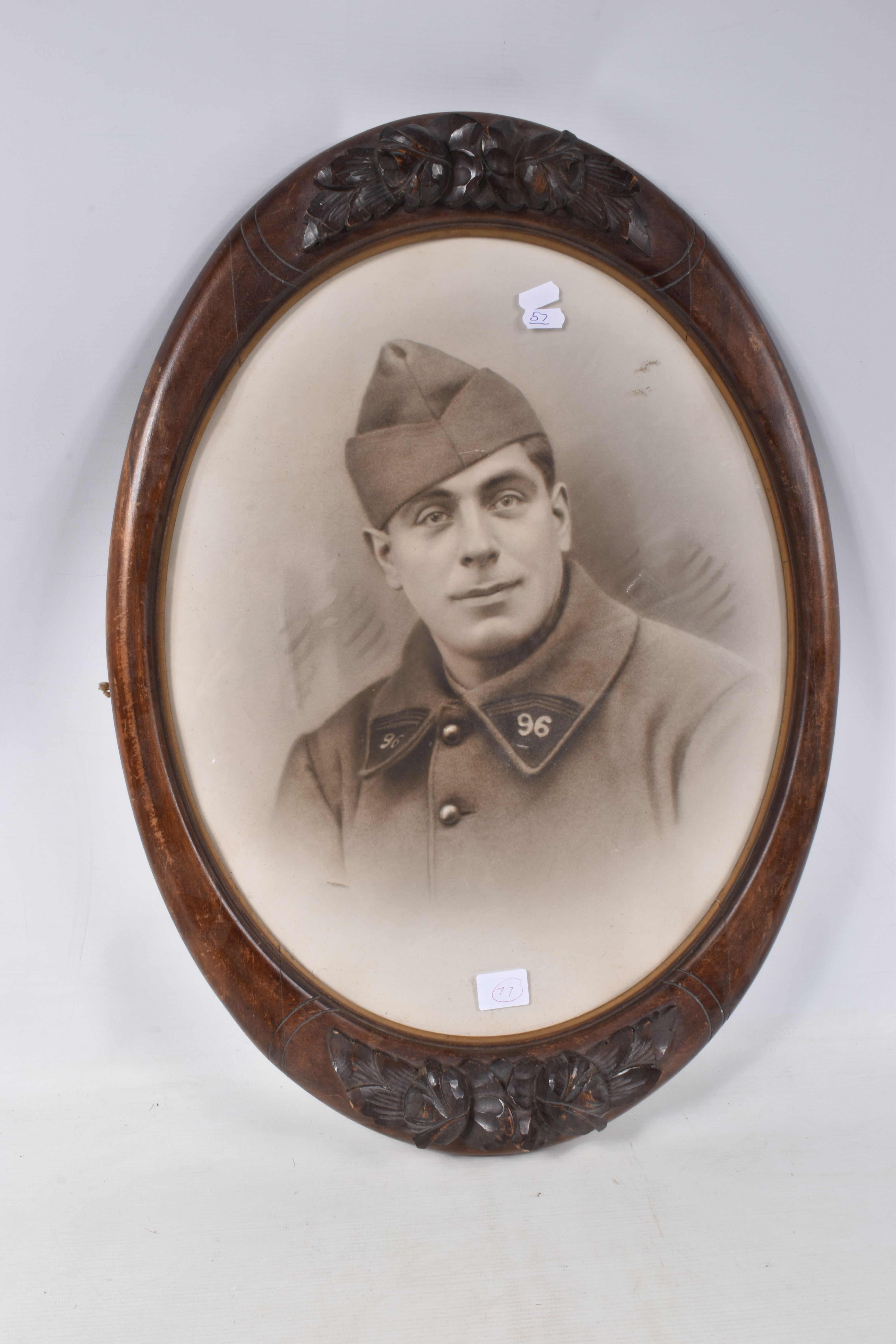 A FRAMED PHOTO OF A FRENCH SOLDIER, the picture is in a carved wooden frame and features a French