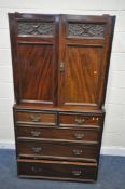 AN EDWARDIAN MAHOGANY COMPACTUM WARDROBE SECTION, enclosing four linen slides, over five drawers,