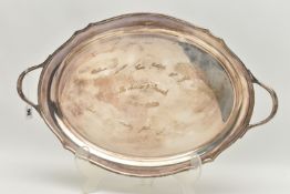 A GEORGE VI SILVER OVAL TWIN HANDLED TRAY WITH WAVY EDGE, the front inscribed with presentation