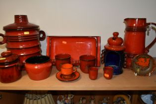 A GROUP OF WEST GERMAN POTTERY KITCHEN WARE ITEMS, mostly red glazed, including a conical jug,