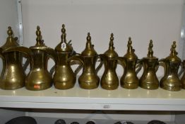 TEN LATE 19TH / 20TH CENTURY MIDDLE EASTERN BRASS DALLAH, some with residual tinning, eight plain