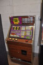 A VINTAGE BELL FRUITS SLOT MACHINE with 'Bonus Fruits' graphics and mechanism, height 144cm (