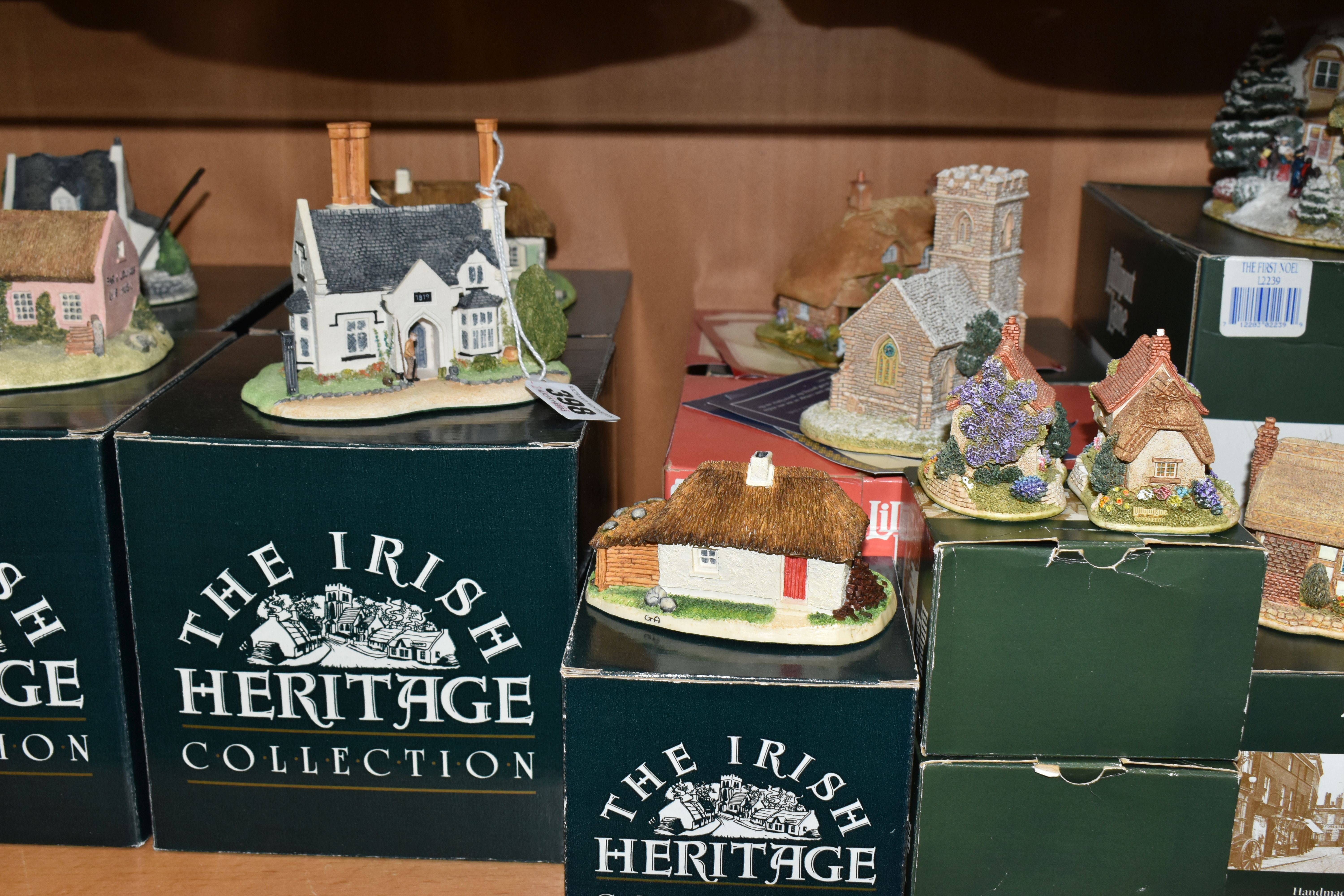 A COLLECTION OF BOXED LILLIPUT LANE AND THE IRISH COLLECTION SCULPTURES, comprising seven Lilliput