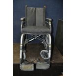 A SUNRISE MEDICAL FOLDING WHEELCHAIR, with additional cushion and footrests