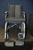 A SUNRISE MEDICAL FOLDING WHEELCHAIR, with additional cushion and footrests