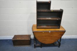 A 20TH CENTURY OAK GATE LEG TABLE, with barley twist supports, a four tier open bookcase, and an oak
