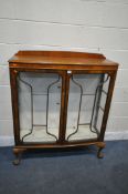 A WALNUT TWO DOOR CHINA CABINET, enclosing two glass shelves, width 105cm x depth 36cm x height