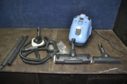 AN UNBRANDED STEAM CLEANER, with accessories (condition report: turned on but untested)