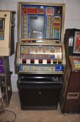 A JPM SLOT MACHINE with 'Reel Bonus' graphics, width 65cm x height 172cm (untested and maybe