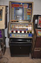 A JPM SLOT MACHINE with 'Reel Bonus' graphics, width 65cm x height 172cm (untested and maybe