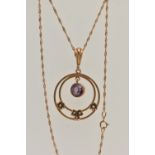 AN EARLY 20TH CENTURY YELLOW METAL LAVALIER PENDANT NECKLACE, the pendant of an open work circular