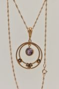 AN EARLY 20TH CENTURY YELLOW METAL LAVALIER PENDANT NECKLACE, the pendant of an open work circular