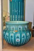 A BRETBY JARDINIERE AND STAND, an arts and crafts style turquoise glazed pottery jardiniere with a