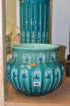 A BRETBY JARDINIERE AND STAND, an arts and crafts style turquoise glazed pottery jardiniere with a